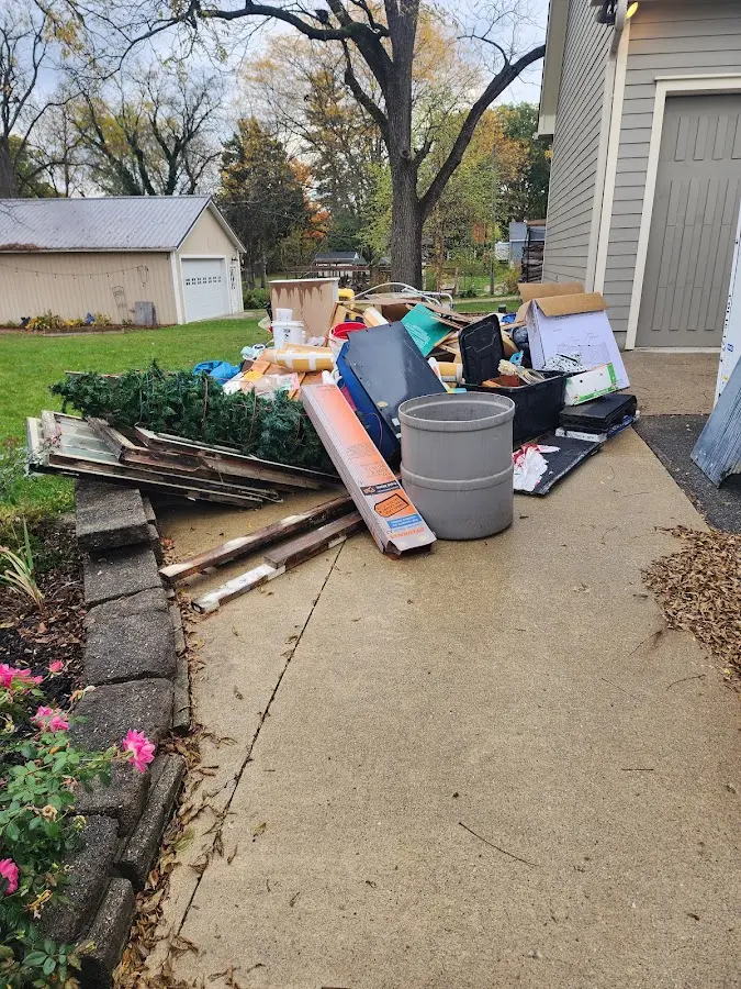 Dumpster being loaded with debris for 30 Yard Dumpster Rental in Roxbury